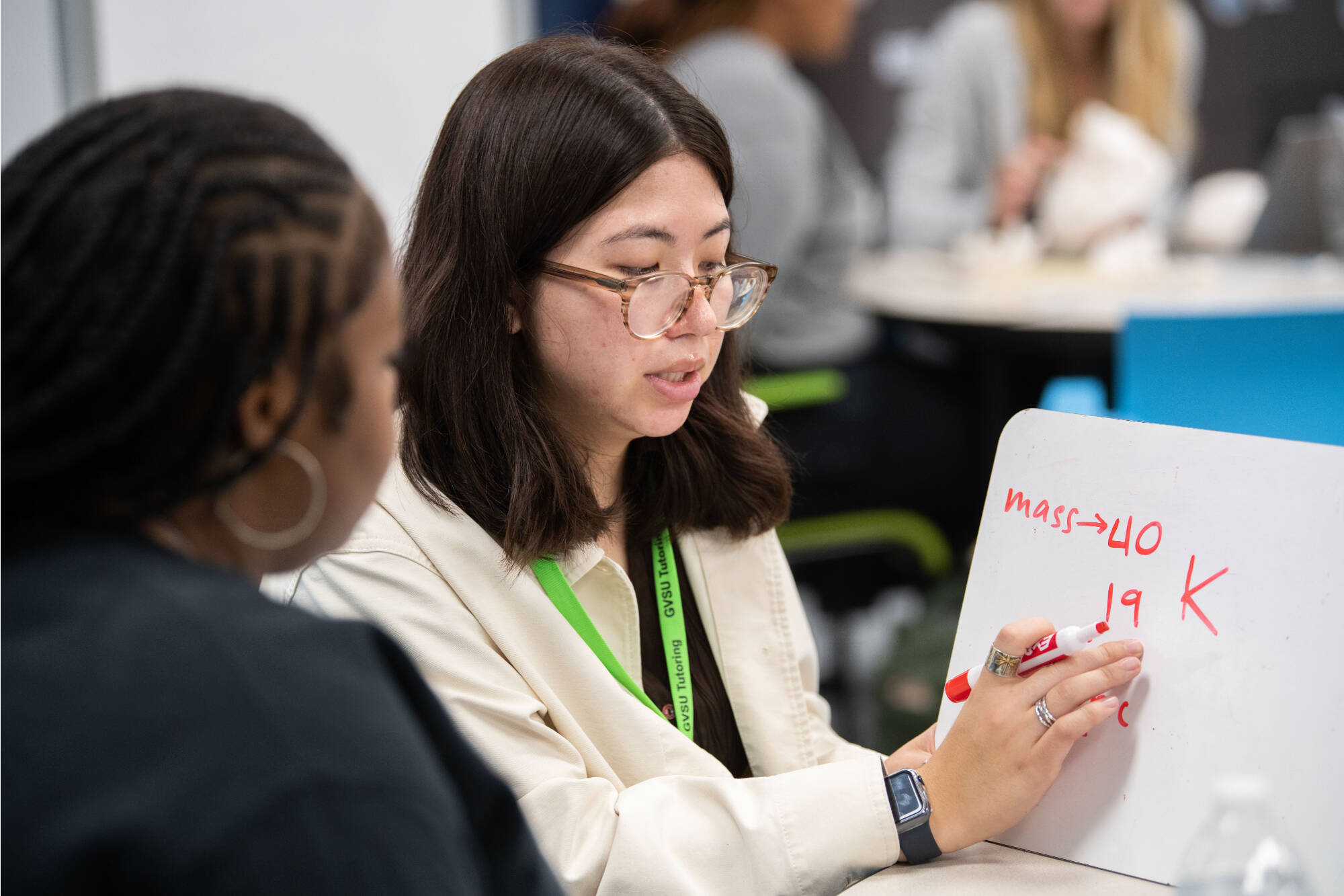 Angela Tran, right, tutors Jainell Denham Carter, left, in chemistry in the new Tutoring and Reading Center in Henry Hall September 27.(Photo releases on file)